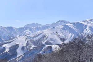 Hakuba Happo-One ski slopes with snowy mountains in Nagano