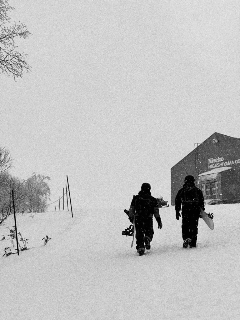 Snowboard Niseko instructors walking to the gondola in Niseko Village